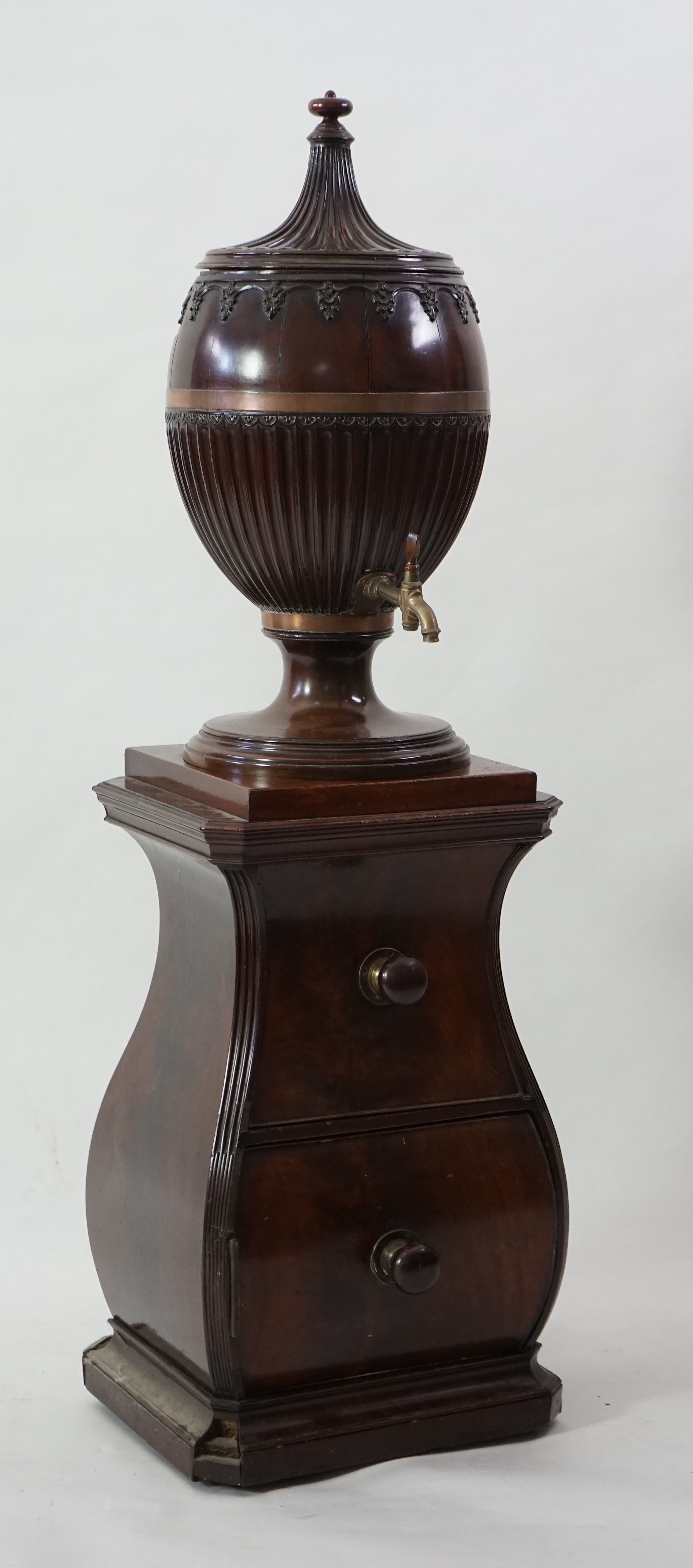 An 18th century Dutch carved mahogany wine cooler and cover